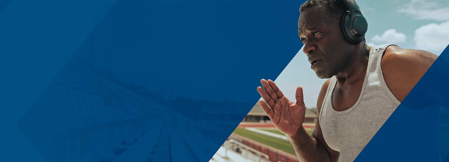 PYLARIFY patient Paul Running Paul, a PYLARIFY patient, running outside with headphones on